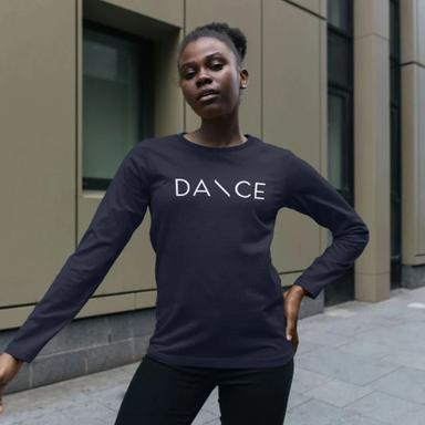 A young woman wears a long sleeved cotton tshirt with the word "DANCE" printed across the front