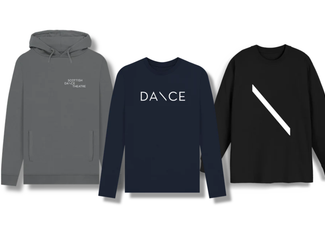 Examples of Scottish Dance Theatre clothing featuring a grey hooded sweatshirt with the Scottish Dance Theatre logo, a long sleeved tee with "Dance" printed on the front, and a black long sleeved sweatshirt with the Scottish Dance Theatre logo.