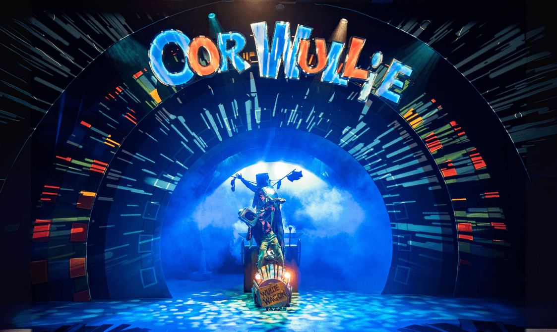 Oor Wullie's Wullie Wagon silhouetted in blue